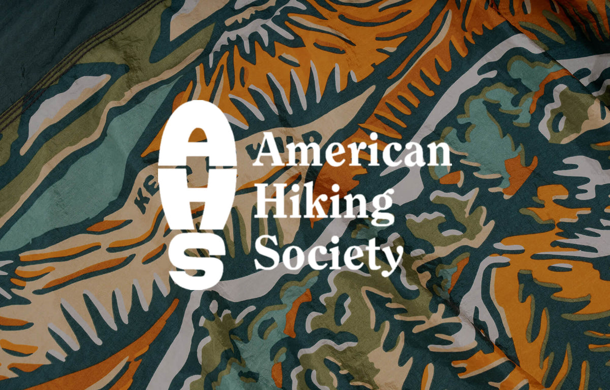 American Hiking Society logo on a fabric detail patterned background