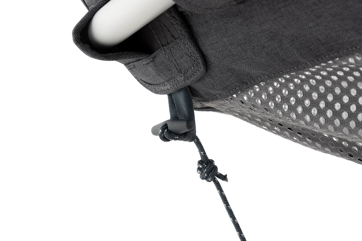 Detail image of the toggle of the ENO Hammock Stand ENO Hammock Stand Tether System's plastic toggle looping through integrated loop of the ENO DayLoft Hammock to provide stability while hammocking.