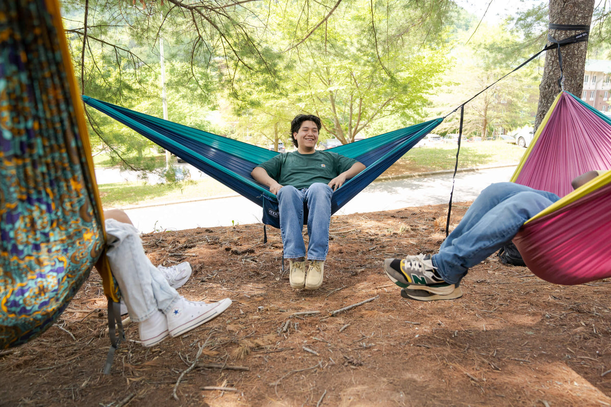 4 people hammocking in three ENO DoubleNest hammocks