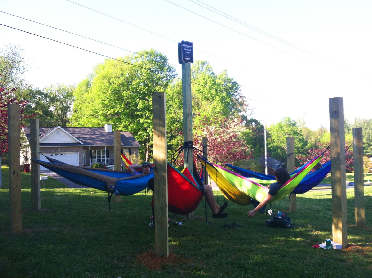 Six people in six different ENO hammocks on various hammocking posts
