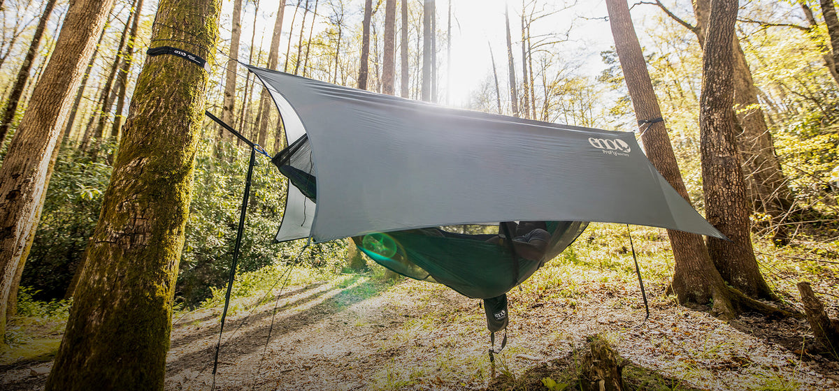 ENO OneLink Hammock System hanging between trees in a forest