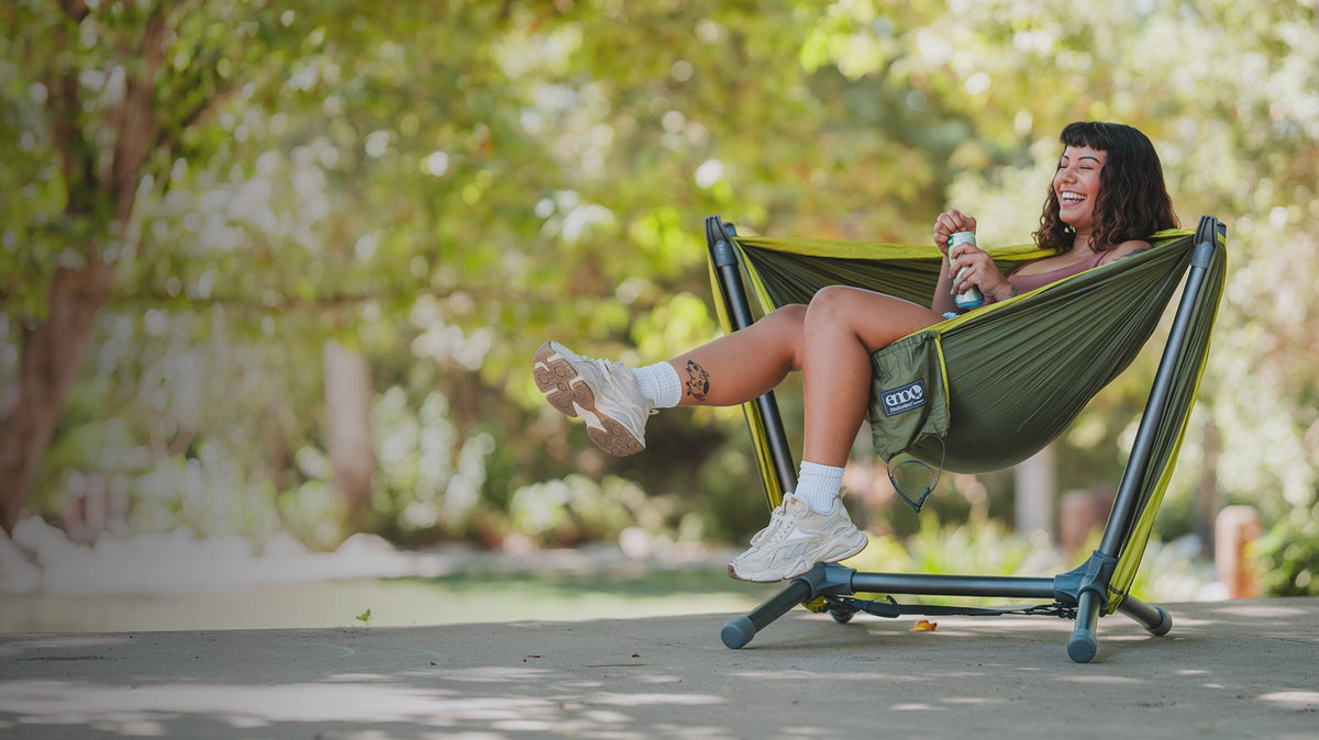Load video: Looping animation of the ENO Parklite Hammock Chair Stand in Charcoal, Agave, and Sky colorways.